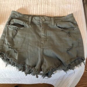 Boutique-bought Army green, distressed shorts.